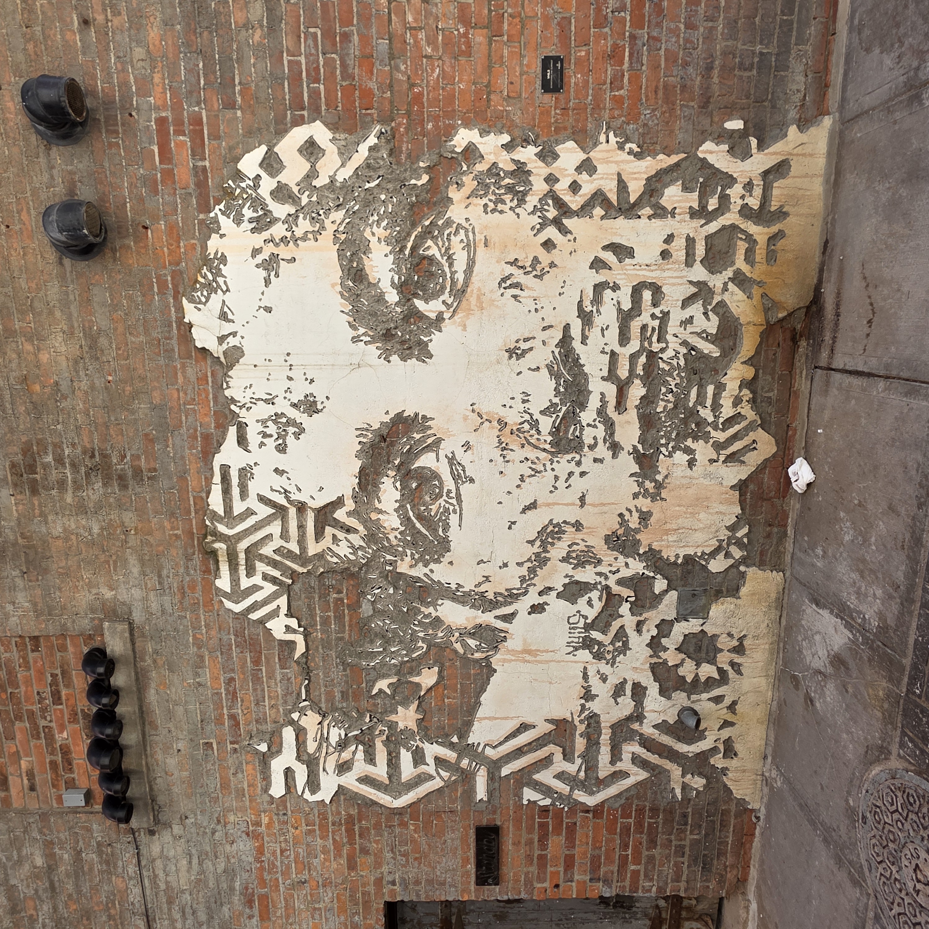 mural in Detroit by artist Vhils.