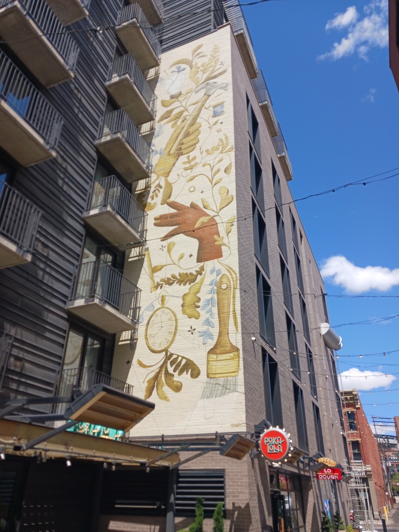 mural in Denver by artist Magik Studios.