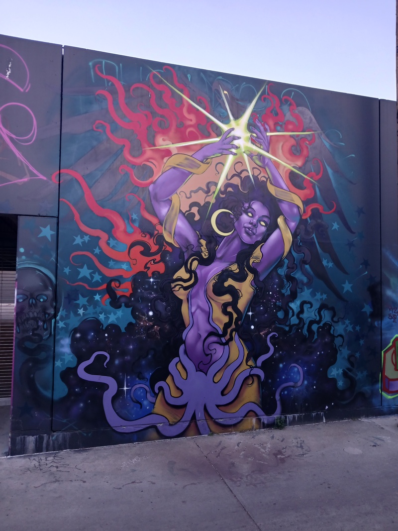 mural in Denver by artist Jher Seno.