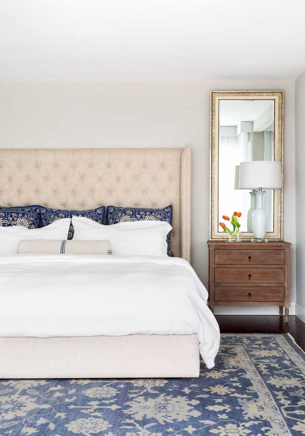 Traditional Bedroom With Upholstered Headboard And Antique Wood ...