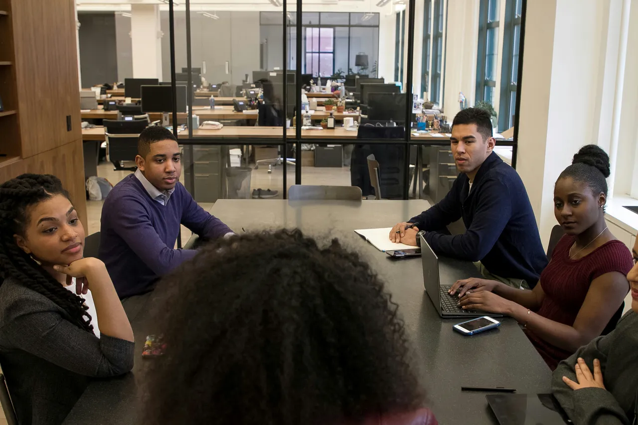 Young Professionals in Modern Office Meeting for The Ultimate Guide on How to Evaluate Mergers and Acquisition