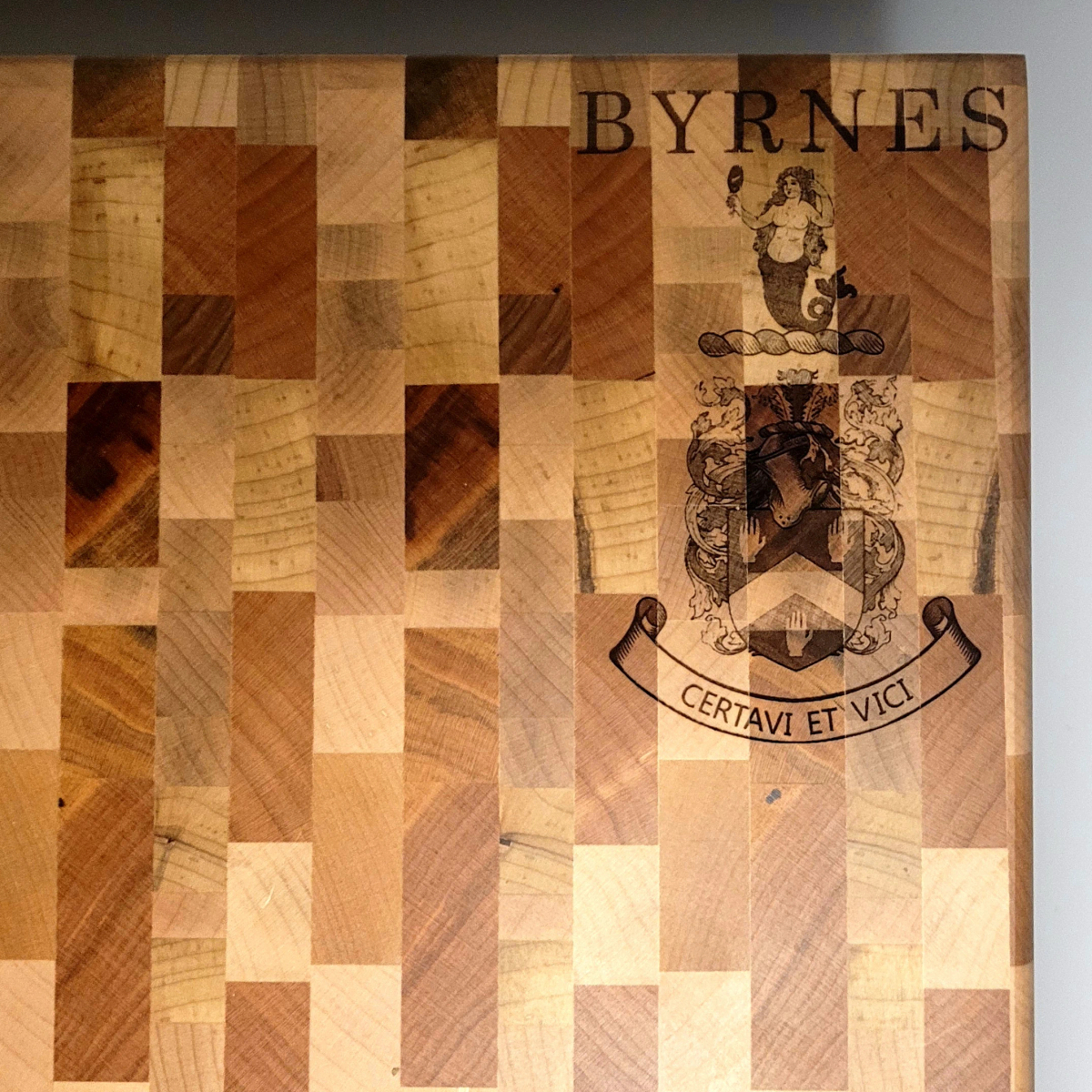 Byrnes family crest laser engraved into hardwood by Flint's Woodshop