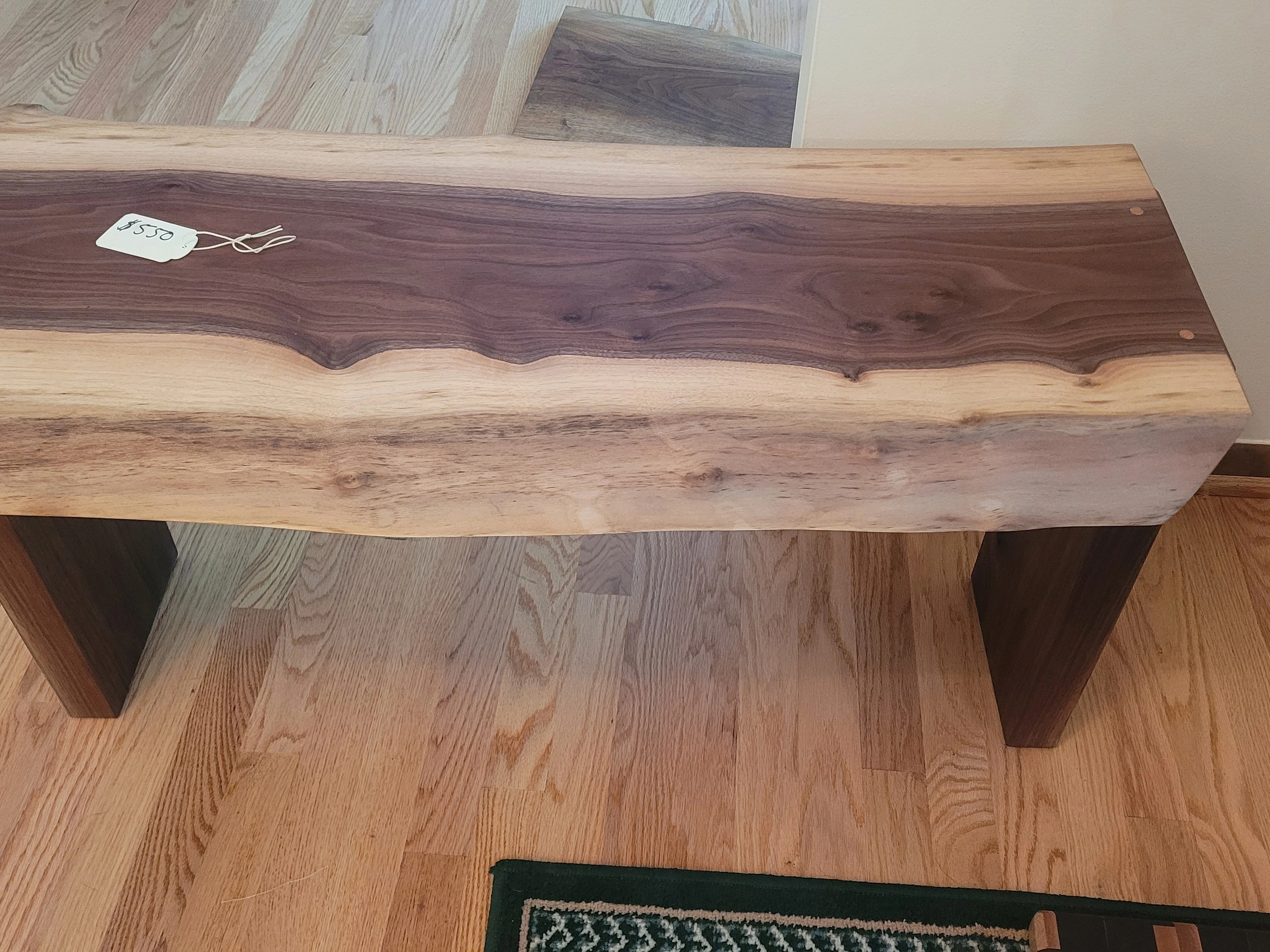 Front and top view of live edge walnut bench showcasing natural edge detail
