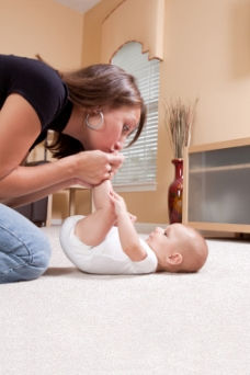 woman and baby playing on a beautiful carpet in a Vancouver home