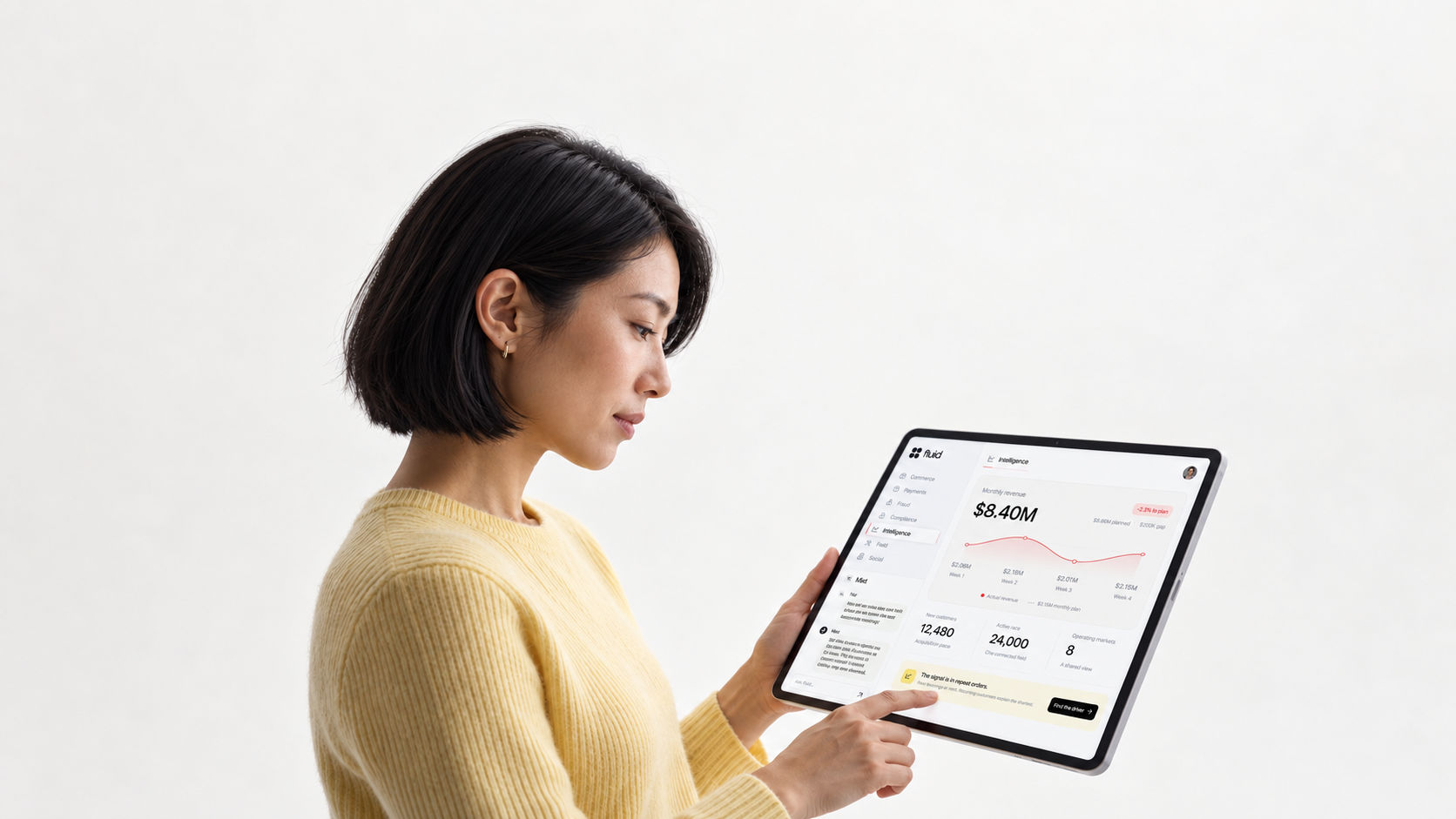 A woman using Fluid on a tablet with business information and Mist in view