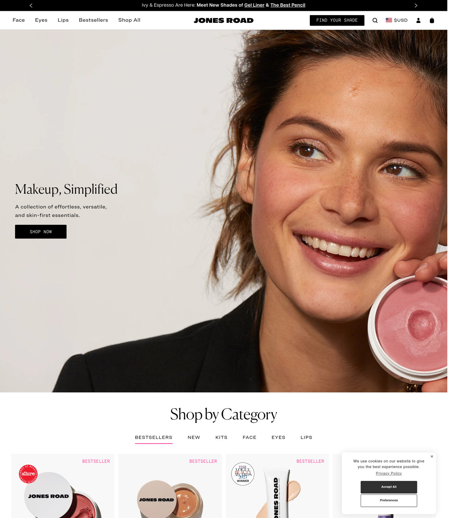 Jones Road homepage: Makeup Simplified, a natural-looking woman holding Miracle Balm, award badges