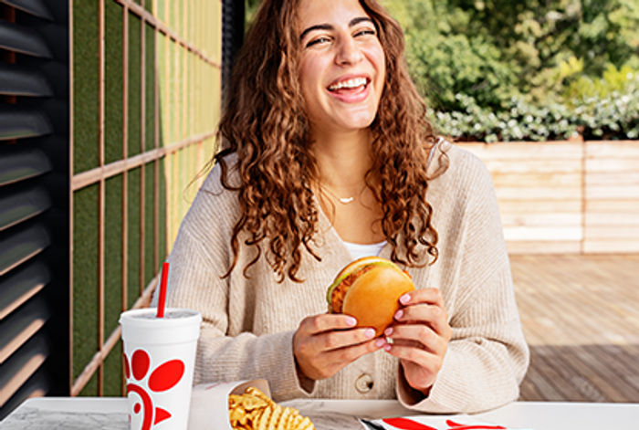 A smiling Chick-fil-A guest