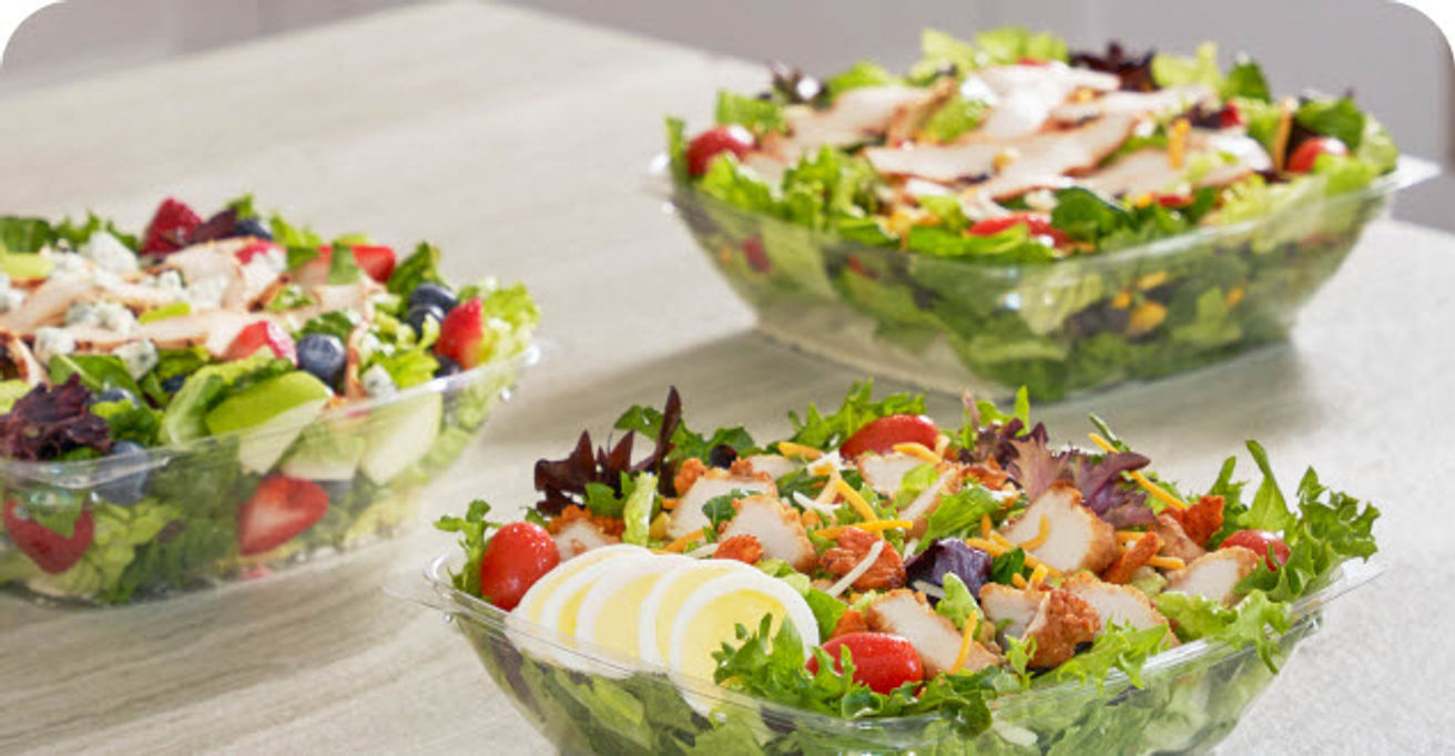 The Cobb Salad, Market Salad and Spicy Southwest Salad city on a table