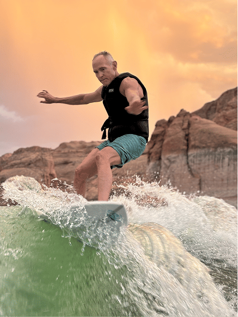 Dr. Porter wakesurfing at sunset