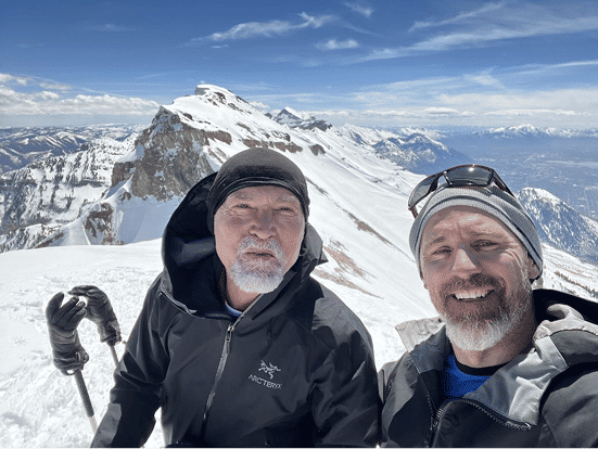 Dr. Porter with friend on a snowy backcountry summit
