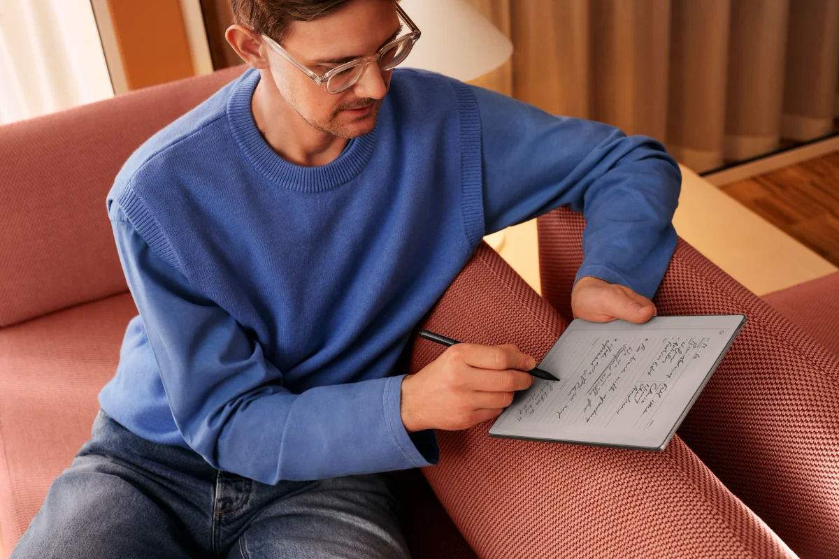 A man writing on the reMarkable device.