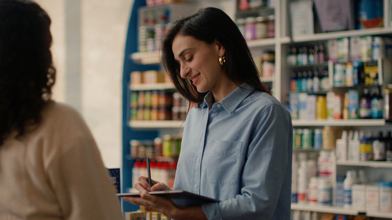 A reMarkable paper tablet being used to take notes with the Marker in a shop.