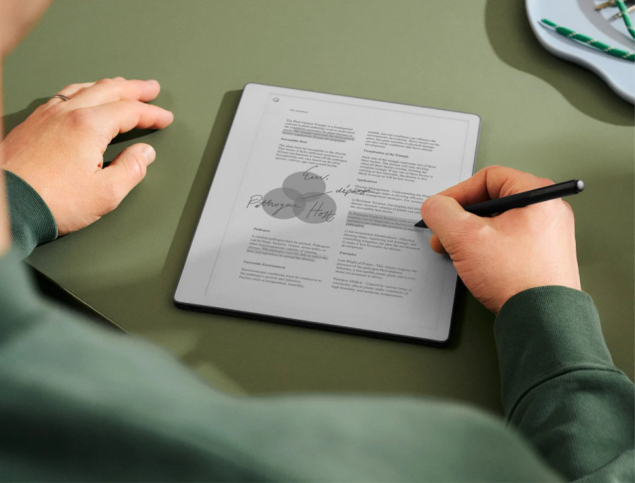 A man reviewing a document on his reMarkable paper tablet.