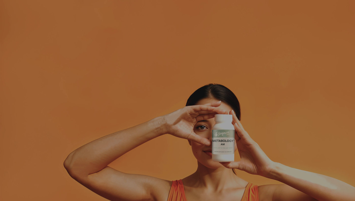 Woman holding Tangerine Metabology AM