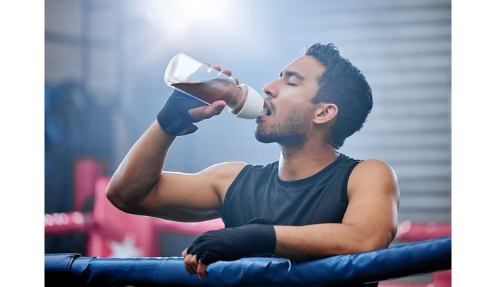 mixed-martial-arts-fighter-hydrating-after-a-workout