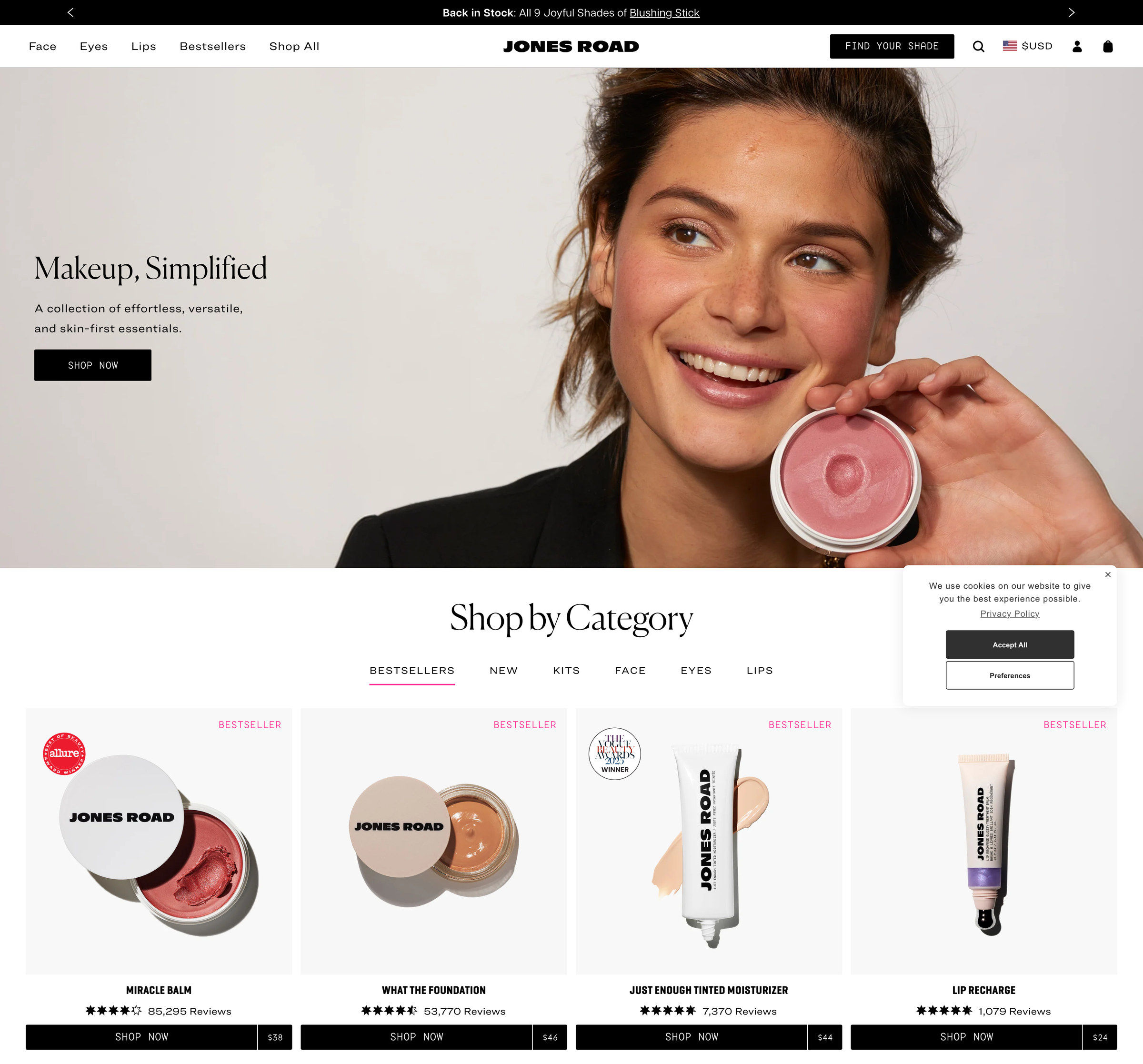 Jones Road homepage: Makeup Simplified, a natural-looking woman holding Miracle Balm, and a Shop by Category row of bestsellers carrying Allure and award badges with prices and review counts