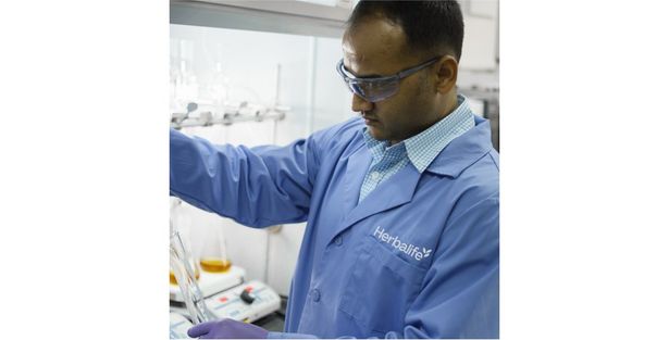Scientist in the lab testing a product in the lab