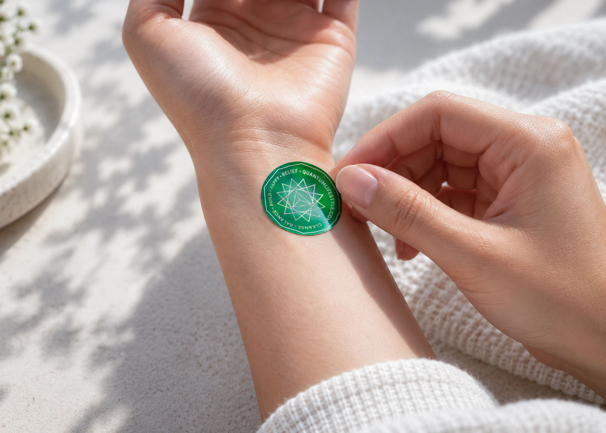 A green QuantaGram worn on the inner wrist