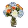 Orange Skies featuring Blue Hydrangea, White Disbuds, Orange Roses accented with Green Hypericum