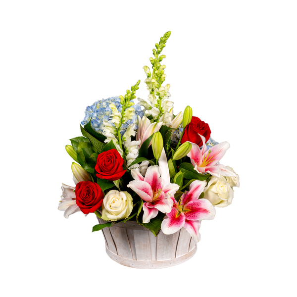 Basket Of Dreams containing White Snapdragons, Blue Hydrangea, Pink Lilies and Red and White Roses