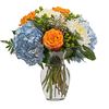 Orange Skies featuring Blue Hydrangea, White Disbuds, Orange Roses accented with Green Hypericum