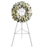White 18" Serenity Wreath featuring white lilies, carnations and mums
