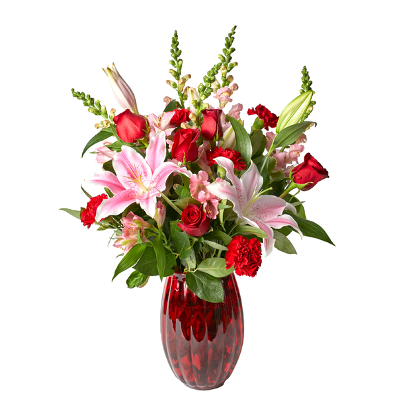 True Romance features Pink Stargazer Lilies, Red Roses, Pink Snapdragons, Red Carnations and Pink Alstroemerias