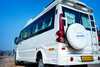 Side profile of luxury tempo traveller parked outdoors