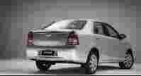 Silver Toyota Etios sedan shown from the rear, featuring a sleek design against a neutral gray background.