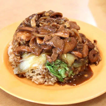 White Rice Drenched With Rich Gravy, Pork Slices, Chinese Sausages, Squids, Prawns, Vegetables And A Piece Of Omelette In It