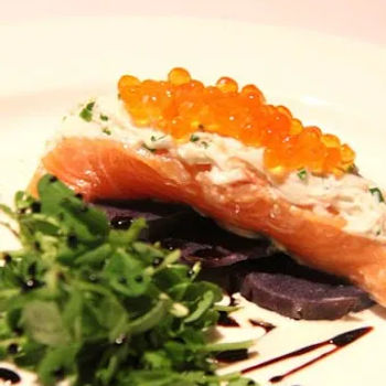 Home Tea Smoked Salmon Served On Purple Potatoes Slices, Alaska Crab Crème Fraiche, Ikura Pearls And Organic Petit Sprouts