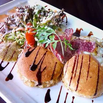 Centurion Pecorino Pancakes, complemented with fried eggs, bacon and guacamole dip