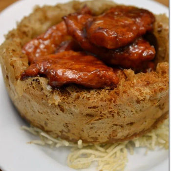 Crispy Yam Basket Filled With Boneless Chunks Of Spare Ribs In Sweet And Sour Sauce