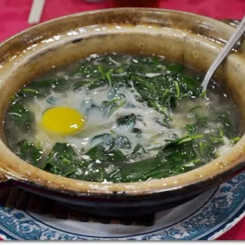 Spinach in Superior Stock with an Egg