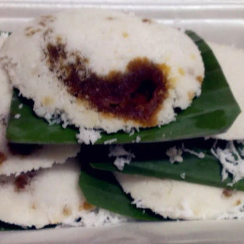 Putu Piring @ Jalan Tengkera- Round, steamed rice cake with a  mouthful of palm sugar and hugely shredded coconut.