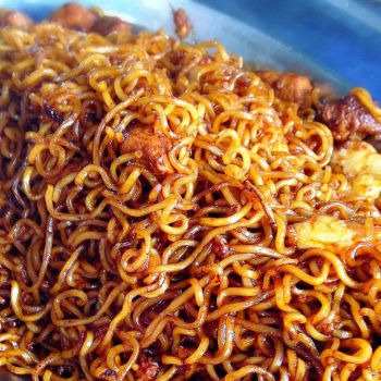 Fried Maggi mee noodle with canned braised cubed pork and sliced sea prawn