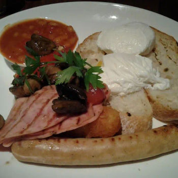 Breakfast Platter-served with smoked chicken sausage, two poached runny egg, grilled turkey bacon, sauteed mushroom, hash brown, toast, toasted tomatoes
