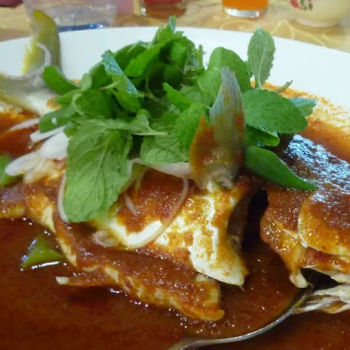 Assam Golden Promfret topped with sliced onion and mint leaves