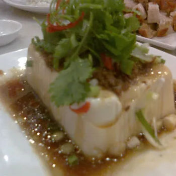 Bean Curd with confit of shallots and garnished with spring onion and coriander