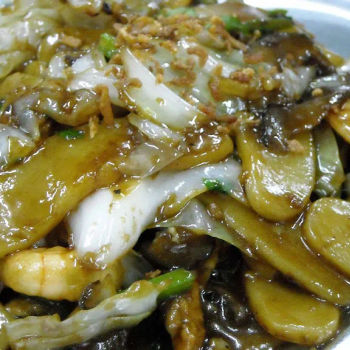 Sliced rice cake noodle cooked the same style-the rice cake noodle was of the right texture and blended well with the other ingredients.