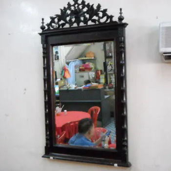 The antique ornate mirror