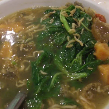 Spinach soup with salted egg, century egg and small anchovies