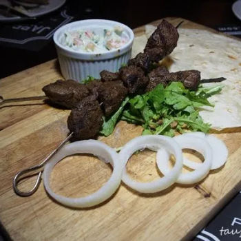 Masala Lamb Skewer with tortillas, rocket salad and raita