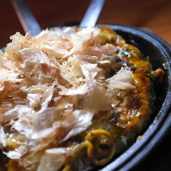 Hiroshima-fu Okonomiyaki is Hiroshima style okonomiyaki with pork and shrimp Japanese Pizza