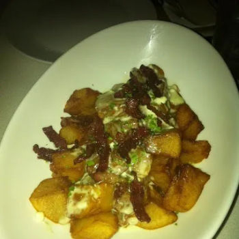 Baked potatoes with blue cheese and bacon bits