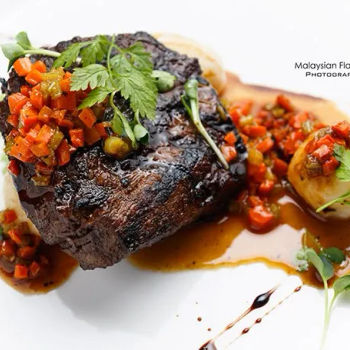 Oven roasted Australian beef Striploin with Gnuddi, soffritto in beef jus, parmesan shaved and extra virgin olive oil