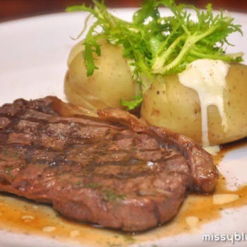 Grilled Black Angus Sirloin served with Baked Potatoes and Sour Cream