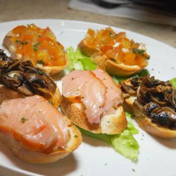 Bruschettas (3 Pieces) With Healthy Toppings Like Tomatoes, Mushrooms And Salmon