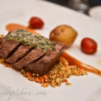 Lamb loin with Crusted Herbs, sautéed Quinoa with lamb sauce, Tomato Ratatouille and Baked Potato
