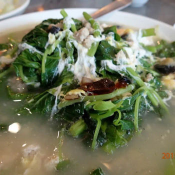 Spinach soup with egg, century egg and salted egg